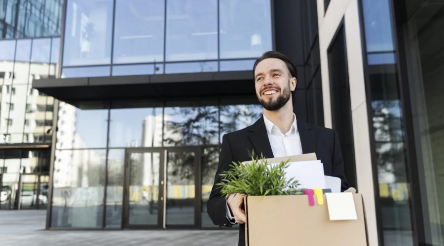 medium-shot-smiley-man-holding-cardboard-box